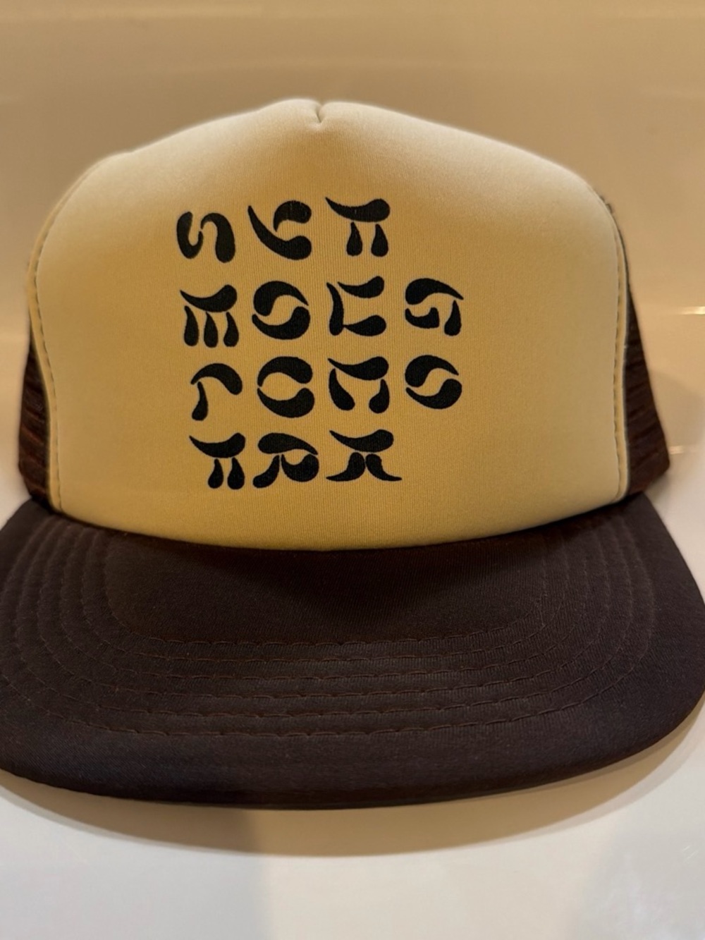 Yellow and Brown Mesh Trucker Hat with Black Graphic